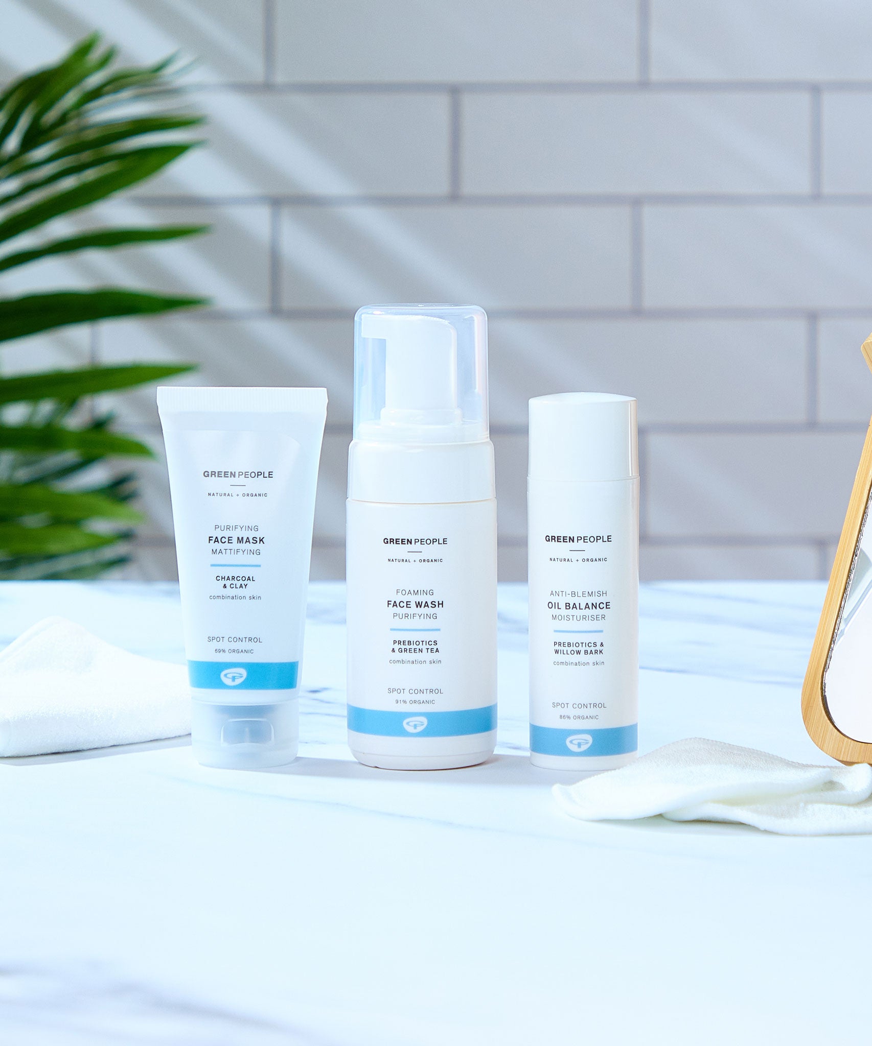 A collection of Green People Organic facial care products, a face mask, foaming face wash and anti-blemish moisturiser.