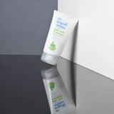 A tube of Organic Babies Baby Wash & Shampoo Scent Free placed on a mirrored surface.