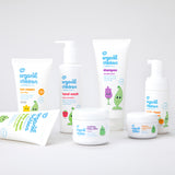 Green People's Organic Children range of baby friendly, natural washes, skincare and sun cream. The products are shown on a plain surface.