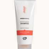 Green People Quinoa & Artichoke protein boost shampoo on a plain background.
