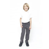 A child wearing Eco Outfitters GOTS organic cotton school uniform trousers - boys slim fit in grey, with a white polo shirt and black shoes, smiling with right thumb in pocket. White background