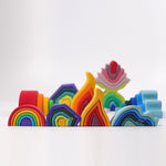 Grimm's Wooden Medium Rainbow stack  with Rainbow Balls on a grey background