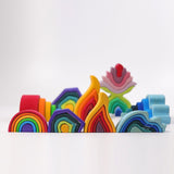 Grimm's Wooden Medium Rainbow stack  with Rainbow Balls on a grey background