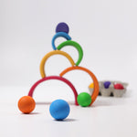 Grimm's Wooden Medium Rainbow as a ball run on a grey background