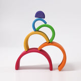 Grimm's Wooden Medium Rainbow stack on a grey background