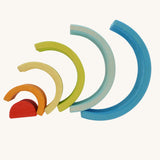 The Grimm's Babi Gwawr Sunrise 6 Piece Rainbow on a plain background.  The pieces are shown spread out in a fan-like pattern.