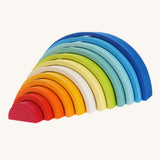 The Grimm's Gwawr Sunrise 12 Piece Rainbow on a plain background. The pieces have been pulled out, creating a tunnel like structure.