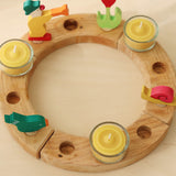 A celebration ring with the Grimm's beeswax candles and tealight holders.