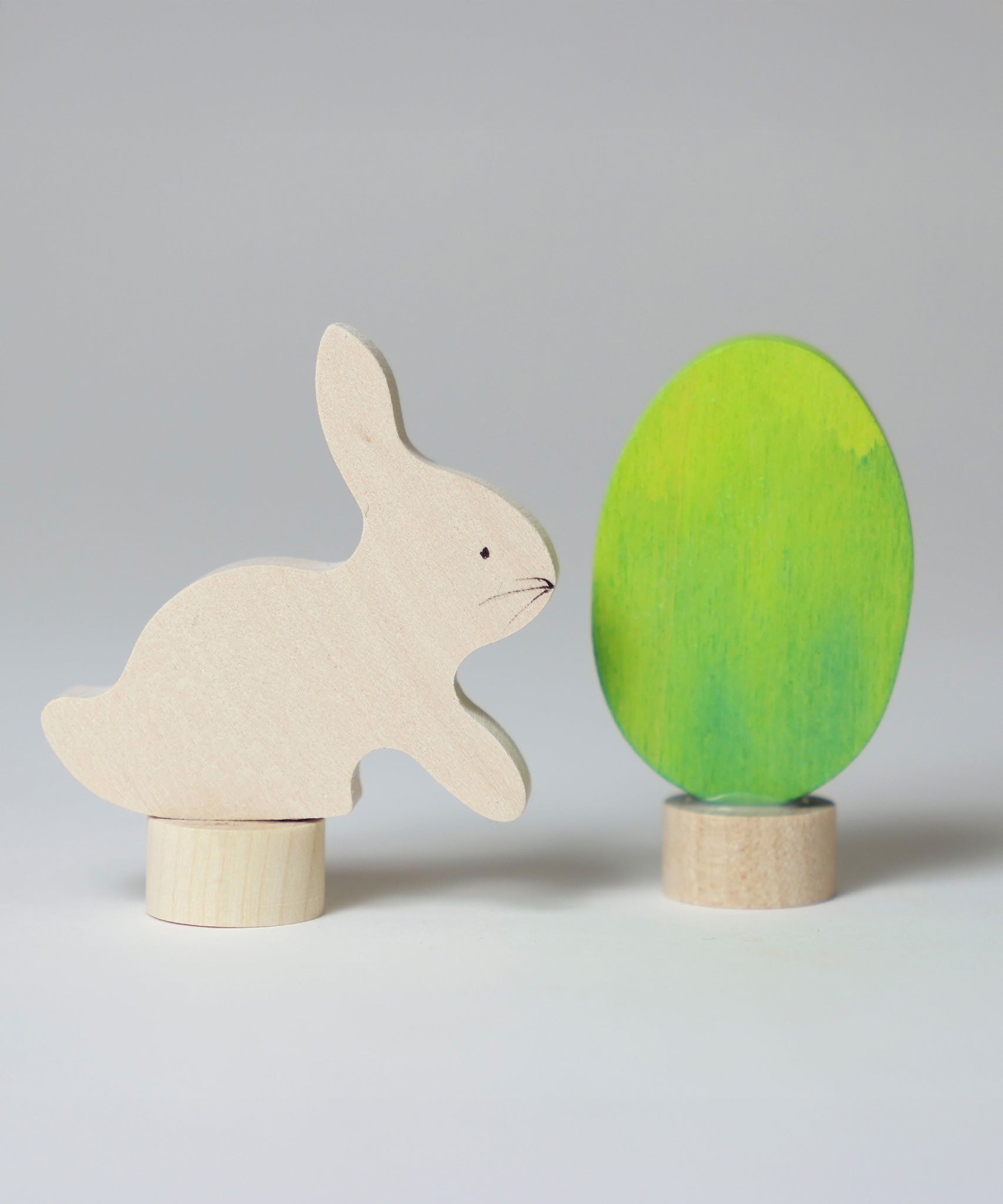 Grimm's Easter Decorative Figure Set featuring a white bunny rabbit a Batik Green coloured eggs.