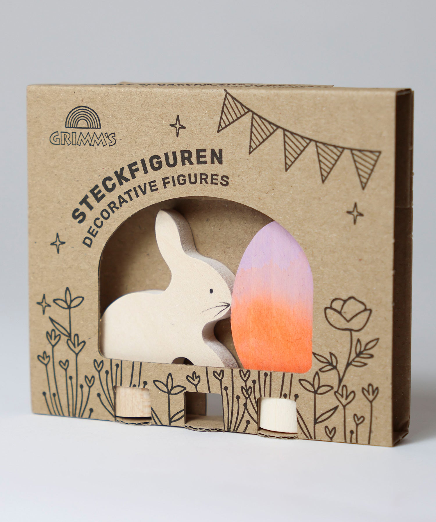A Grimm's Easter Decorative Figure Set. the set includes a white bunny rabbit figure and a Batik Orange and purple coloured egg. The figures are shown in their cardboard packaging sleeve.