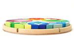 Grimm's Lara Waldorf toy blocks in their round base on a white background
