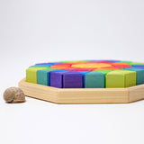 A side view of the tray containing The triangluar shaped blocks from the Grimm's Octagon Puzzles.