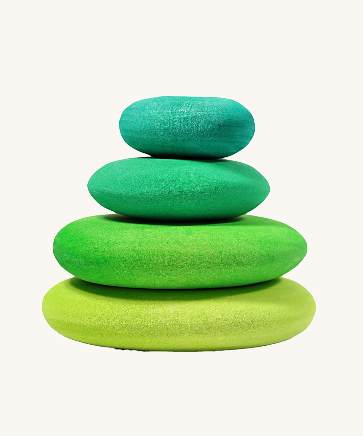 A set of 4 Grimm's wooden pebbles is a moss green colourway.