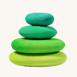 A set of 4 Grimm's wooden pebbles is a moss green colourway.