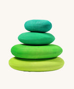 A set of 4 Grimm's wooden pebbles is a moss green colourway.