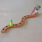 Grimm's Sweet Cone Decorative Figure - Neon Pink. The cone sits in a Grimm's celebration ring.