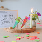 Grimm's Sweet Cone Decorative Figure - Neon Pink. The cone sits in a Grimm's celebration ring and is surrounded by Grimm's Confetti.