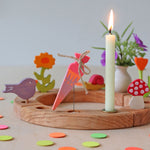 Grimm's Sweet Cone Decorative Figure - Neon Pink. The cone sits in a Grimm's celebration ring and is surrounded by Grimm's Confetti.