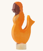 A Grimms wooden mermaid decorative figure in orange. Features a small base stand to slot in the celebration ring
