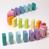 Grimms Wooden Pastel Duo Blocks lined up in an S shape line like dominoes
