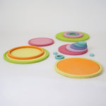 Full Grimm’s wooden concentric circle and ring set, ideal for sensory play, stacking, and sorting.