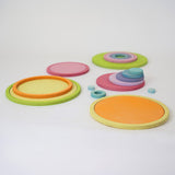 Full Grimm’s wooden concentric circle and ring set, ideal for sensory play, stacking, and sorting.