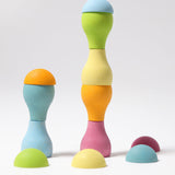 Grimm's Pastel Mushrooms Sorting Game shown with the pieces stacked on top of each other to create little towers.