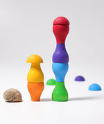 Grimm's Rainbow Mushrooms Sorting Game, the pieces have been stacked on top of each other to create little towers.