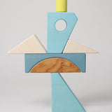 The blocks from the Grimm's blue sail boat building set stacked up.  These Grimm's wooden block sets are part of a wide range of wooden toys available here at Babipur.