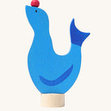 Grimm's wooden seal decorative figure, a blue coloured seal with a red ball on it's nose to fit onto a Grimm's celebration ring. These Waldorf inspired decorative figures are part of a wide range of wooden decorations for celebration rings available here at Babipur.