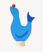 Grimm's wooden seal decorative figure, a blue coloured seal with a red ball on it's nose to fit onto a Grimm's celebration ring. These Waldorf inspired decorative figures are part of a wide range of wooden decorations for celebration rings available here at Babipur.