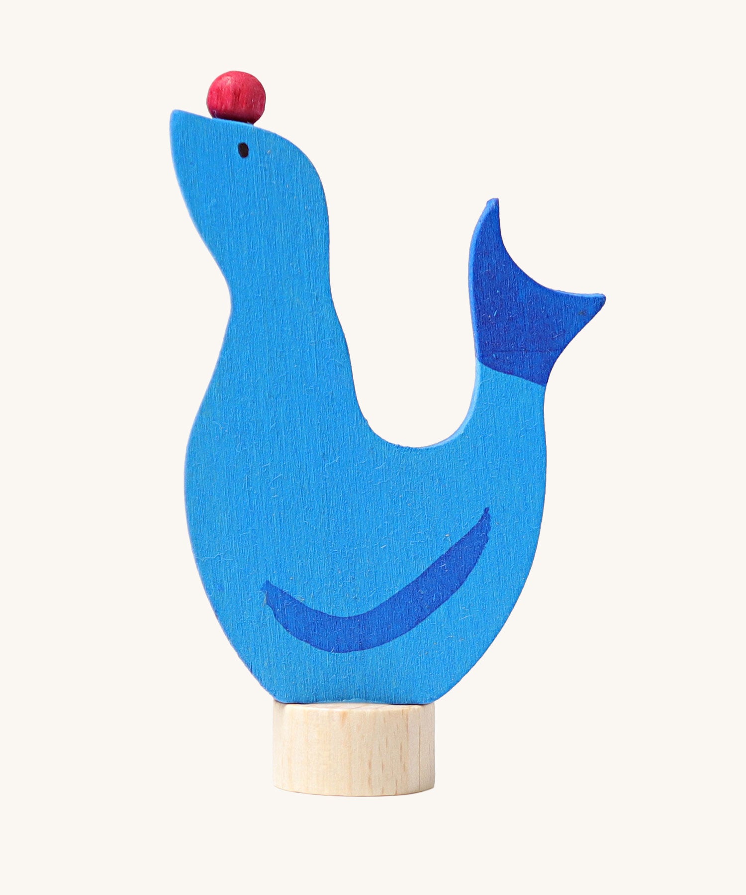 Grimm's wooden seal decorative figure, a blue coloured seal with a red ball on it's nose to fit onto a Grimm's celebration ring. These Waldorf inspired decorative figures are part of a wide range of wooden decorations for celebration rings available here at Babipur.