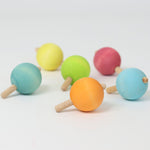 The six pastel rainbow traditional wooden spinning tops from Grimm's
