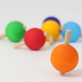 The six rainbow traditional wooden spinning tops from Grimm's