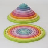 Full Grimm’s concentric circle and ring set laid out by size and colour, ideal for sensory play, stacking, and sorting.