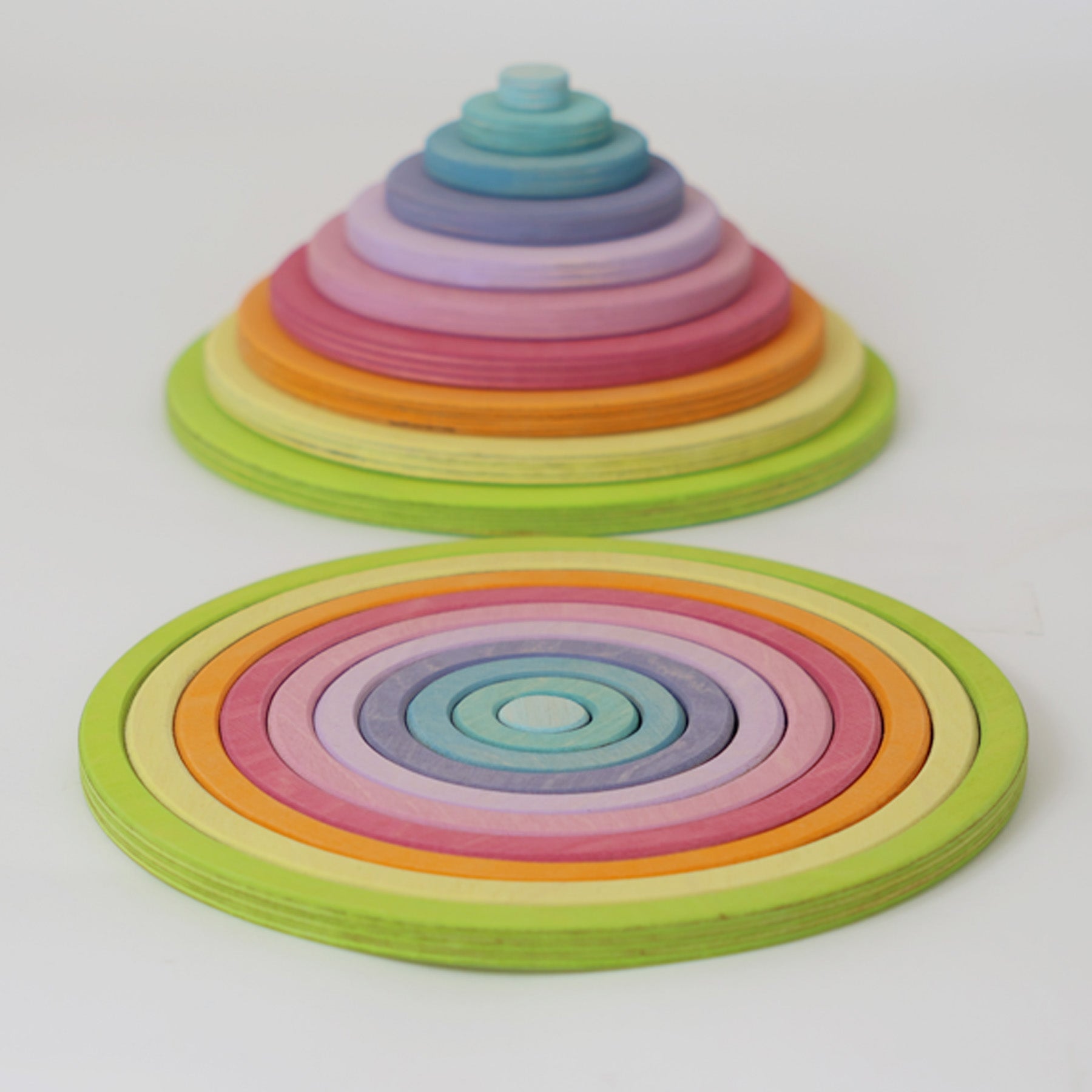 Full Grimm’s concentric circle and ring set laid out by size and colour, ideal for sensory play, stacking, and sorting.