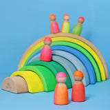 Tower toys and Neon friends are sitting on a shelf in a home environment.