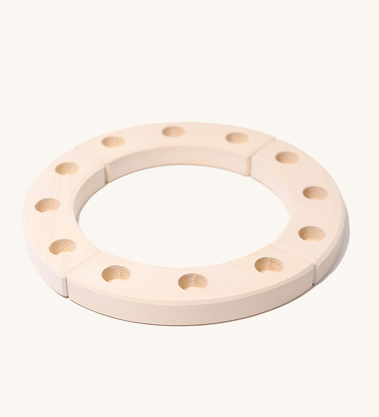 Grimm's White 12-Hole Celebration Ring on a plain background.