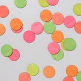 A top down view of the Grimm's Neon Celebration Confetti Dots scattered on a surface
