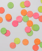 A top down view of the Grimm's Neon Celebration Confetti Dots scattered on a surface