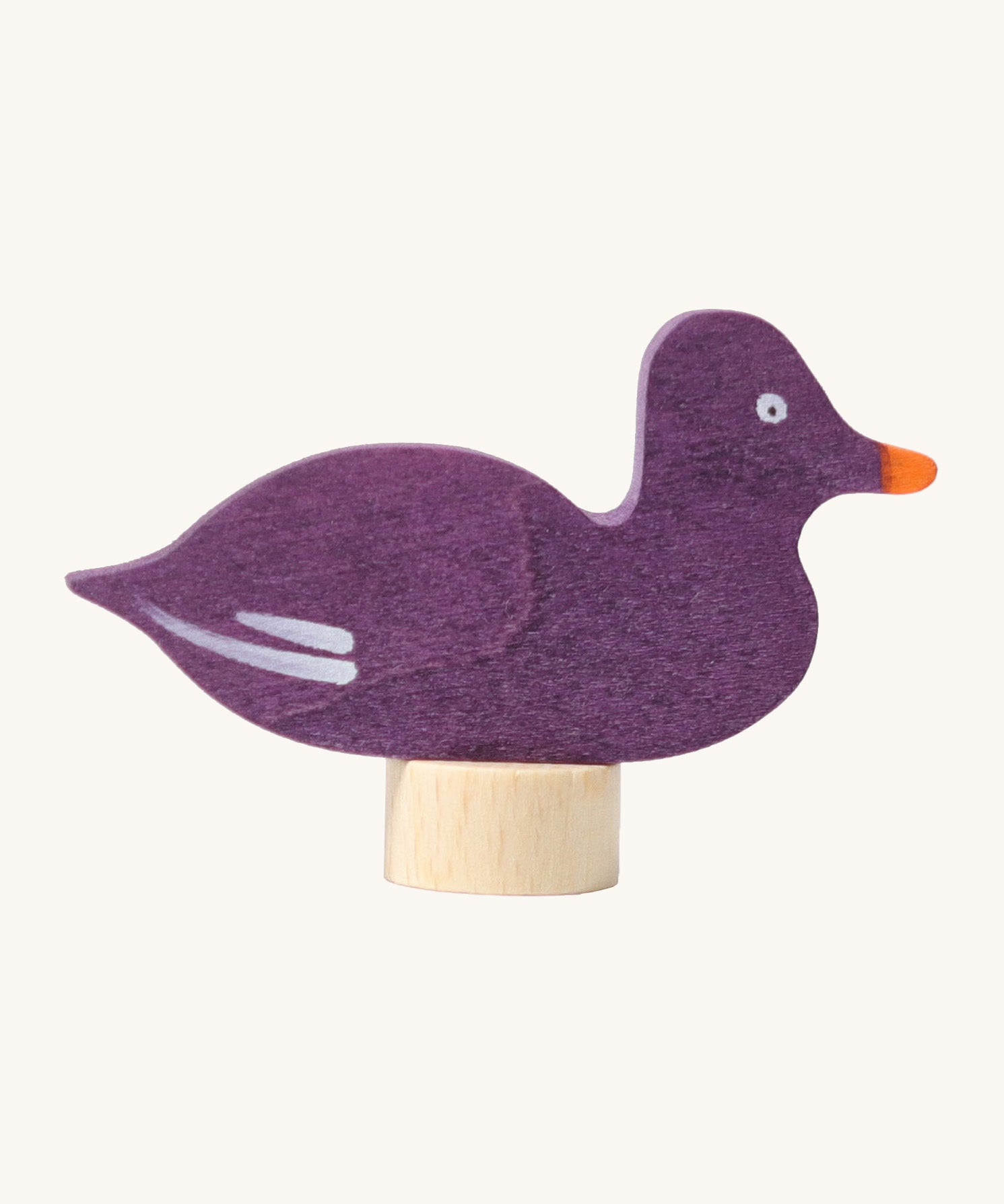 Grimms wooden sitting purple duck decorative figure with a hand painted finish. Features a small base stand on the bottom to slot in a celebration ring