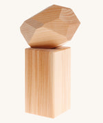 Grimm's Natural Wooden Gem on a plain background.