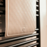 Close up of a Hevea natural rubber bath mat hanging over a towel rail