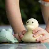Hevea Upcycled rubber sand duck and sage frog toys on the poolside