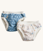 A pack of two Imse Vimse Blue and Teddy design reusable Training Pants for toddlers weighing from 16-20 kg available at Babipur. Two comfortable Cotton reusable training pants. The one on the left is blue with white scribbled sports, and the one on the right is white with colourful rabbits, bears, dogs, rainbows, clouds.