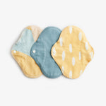 Imse Classic Cloth Pads - Small 3 pack period pads - Blue Sprinkle 3 in blue, yellow and & yellow and blue with white spots & white poppers snaps on a white background