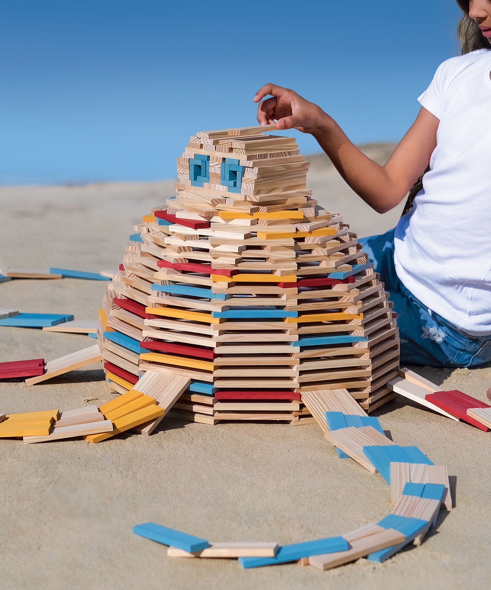 A large circular shaped stack created using the Kapla 200 set in Summer colours.