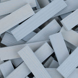 A pile of grey coloured Kapla planks.
