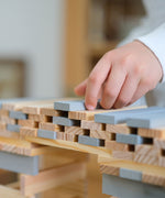 A build created using natural and grey coloured Kapla wooden planks.