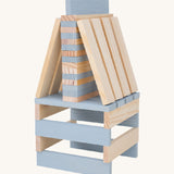 A build created using natural and grey coloured Kapla wooden planks.